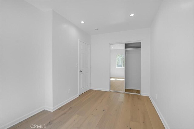 74357437 Balcom Ave, Reseda, CA 91335 - unfurnished bedroom with hardwood / wood-style floors, recessed lighting, a closet, and baseboards