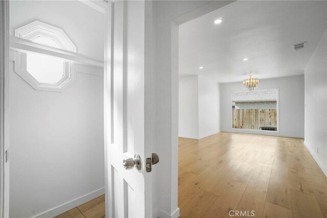 74357437 Balcom Ave, Reseda, CA 91335 - hall with a chandelier, wood-type flooring, baseboards, and recessed lighting
