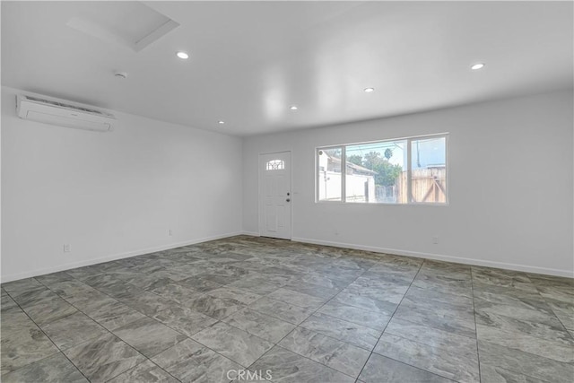 74357437 Balcom Ave, Reseda, CA 91335 - unfurnished room featuring a wall unit AC, recessed lighting, baseboards, and attic access