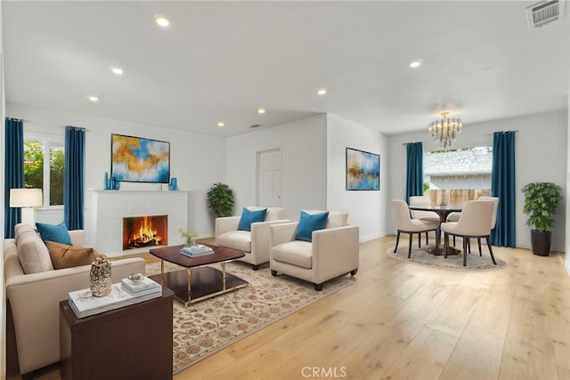 74357437 Balcom Ave, Reseda, CA 91335 - living area featuring a chandelier, wood finished floors, a fireplace, recessed lighting, and baseboards
