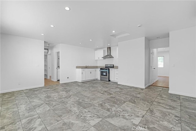 unfurnished living room featuring sink