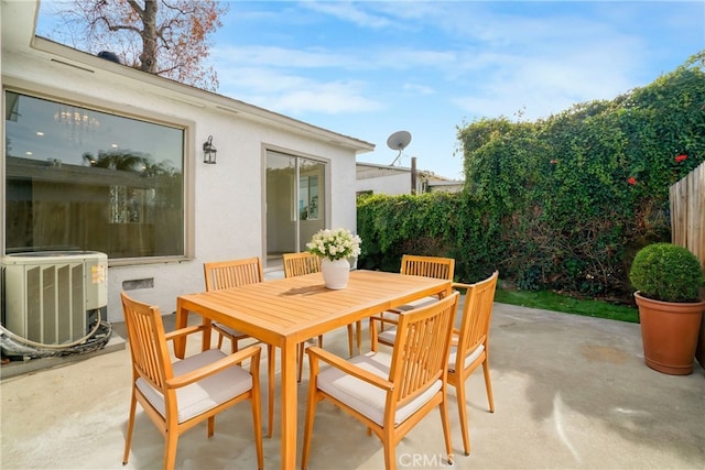 74357437 Balcom Ave, Reseda, CA 91335 - view of patio with central air condition unit, outdoor dining space, and fence