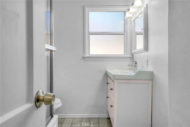 74357437 Balcom Ave, Reseda, CA 91335 - bathroom featuring vanity, toilet, tile patterned floors, and baseboards