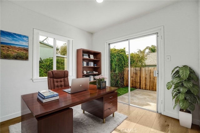 office space with light hardwood / wood-style flooring