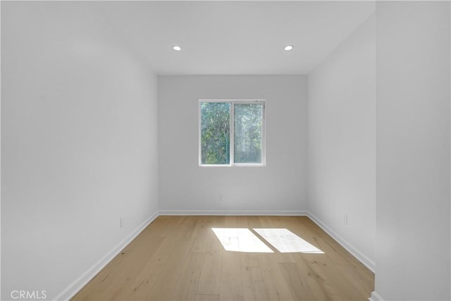 empty room with light hardwood / wood-style floors