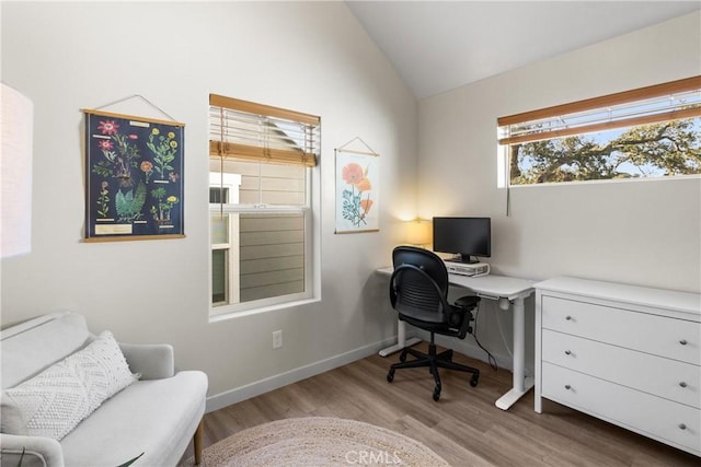 home office with vaulted ceiling, baseboards, and wood finished floors