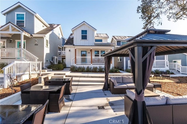 exterior space with an outdoor living space with a fire pit