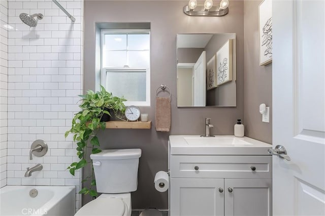 bathroom with toilet, tub / shower combination, and vanity