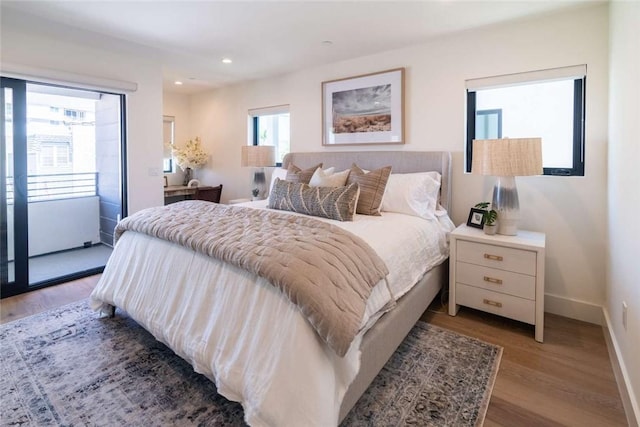 bedroom with hardwood / wood-style floors