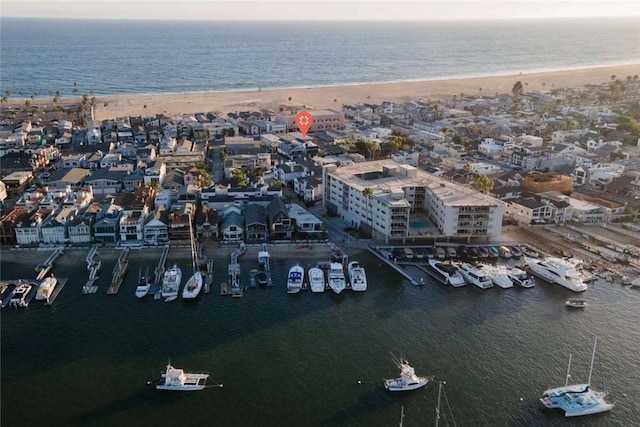 bird's eye view with a water view and a view of the beach