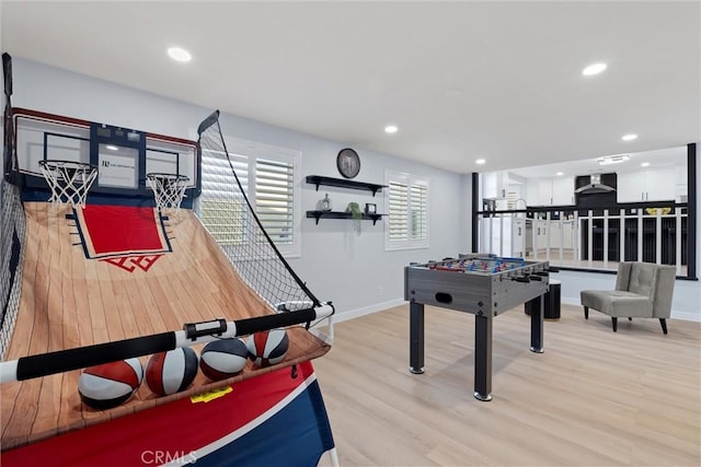 game room featuring light wood-type flooring