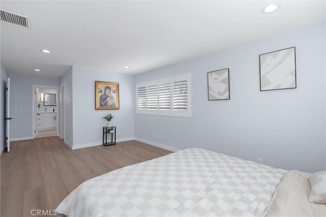 bedroom featuring light wood-type flooring