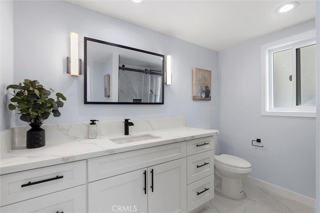 bathroom featuring walk in shower, vanity, and toilet