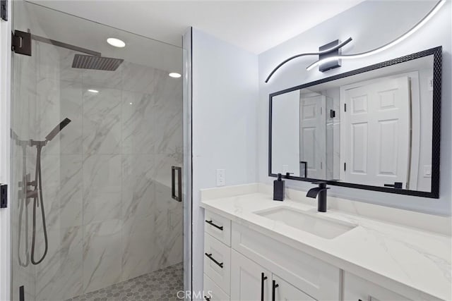 bathroom with vanity and walk in shower