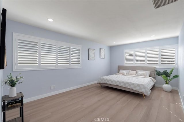 bedroom with light hardwood / wood-style floors