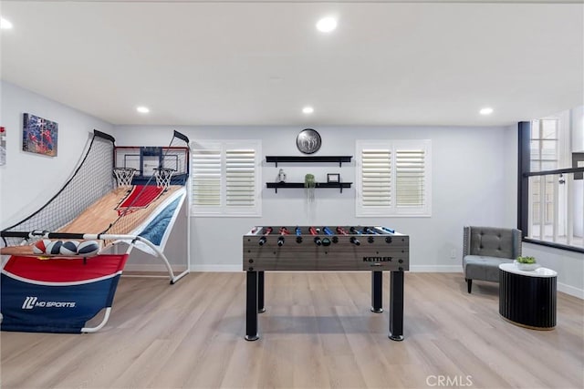 game room featuring light wood-type flooring