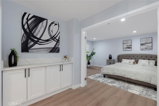 bedroom with light wood-type flooring