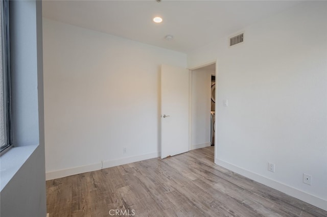 empty room with light hardwood / wood-style floors