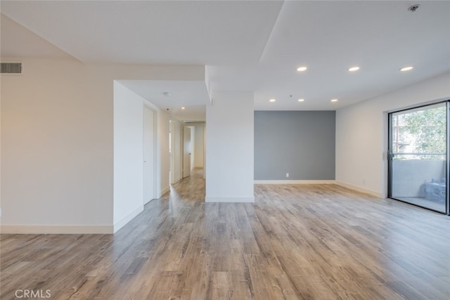 spare room with light wood-type flooring