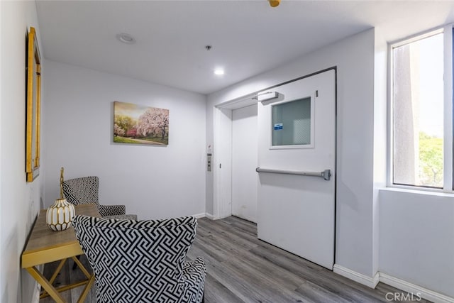 living area with wood-type flooring