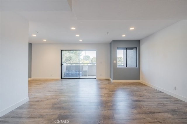 spare room with light hardwood / wood-style floors