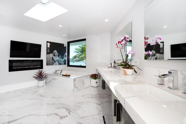 1095 Hoover St, Carlsbad, CA 92008 - bathroom featuring a bath, a skylight, double vanity, marble tiled floors, and recessed lighting