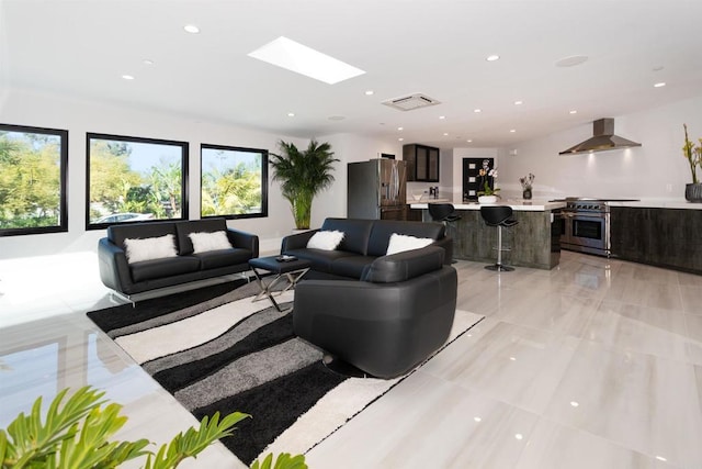 1095 Hoover St, Carlsbad, CA 92008 - living room featuring a skylight and recessed lighting