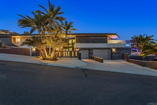 1095 Hoover St, Carlsbad, CA 92008 - view of front of house featuring stucco siding, driveway, and a garage