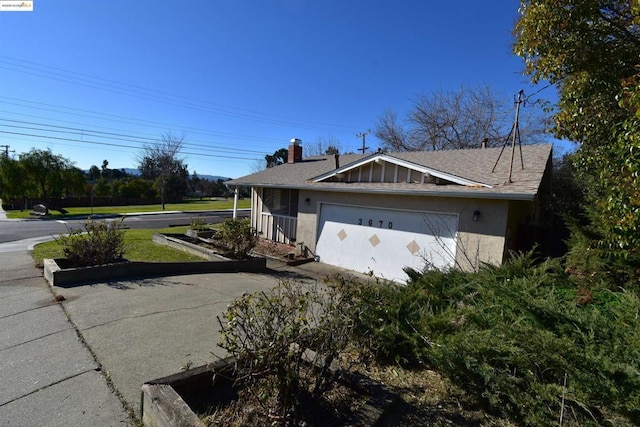 view of home's exterior with a garage