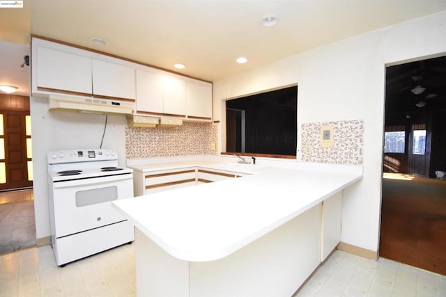 kitchen with kitchen peninsula, sink, white cabinetry, decorative backsplash, and white electric range