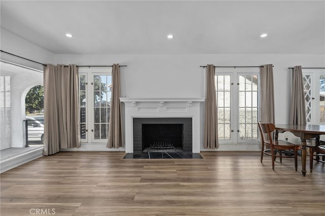 4816 7th Ave, Los Angeles, CA 90043 - living room featuring wood finished floors, a fireplace with flush hearth, recessed lighting, and french doors