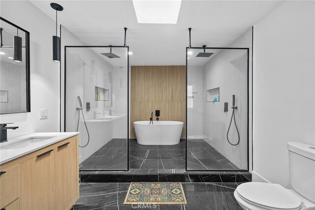 4816 7th Ave, Los Angeles, CA 90043 - full bathroom featuring marble tiled floors, toilet, a walk in shower, vanity, and a skylight