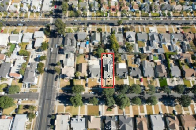 4816 7th Ave, Los Angeles, CA 90043 - aerial view of property and surrounding area with property parcel outlined and nearby suburban area
