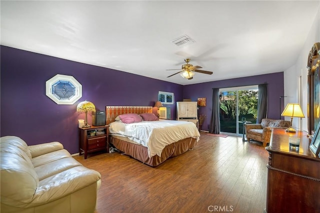 bedroom with ceiling fan, access to outside, and wood-type flooring