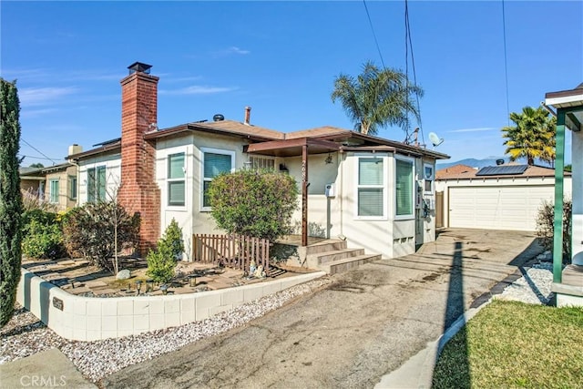 bungalow featuring a garage