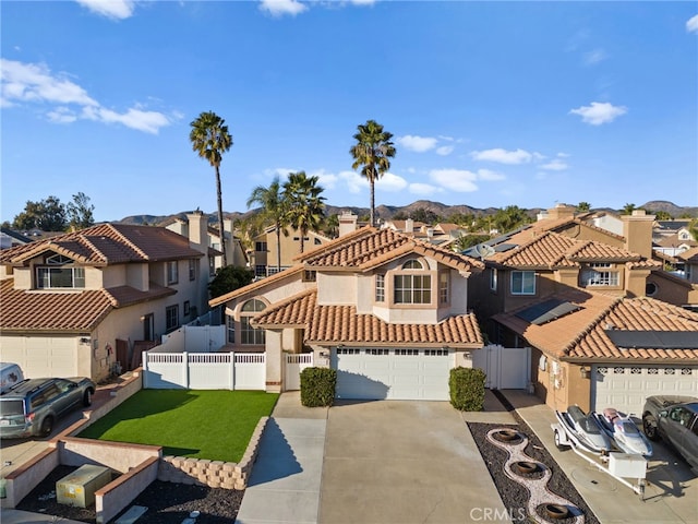 view of front of home with a garage and a front lawn