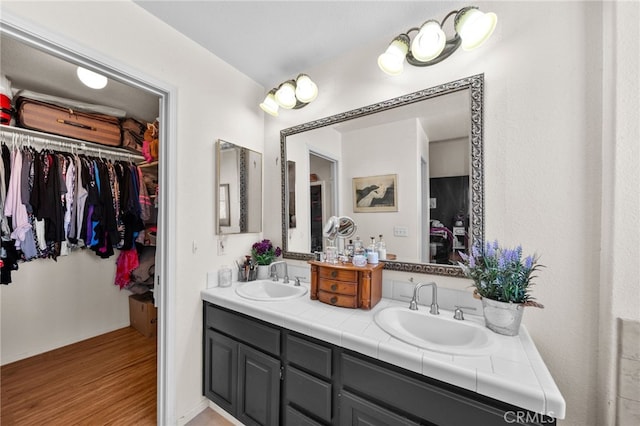 bathroom with vanity and hardwood / wood-style floors