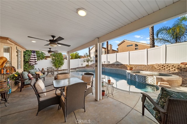 view of patio / terrace with a pool with hot tub and ceiling fan