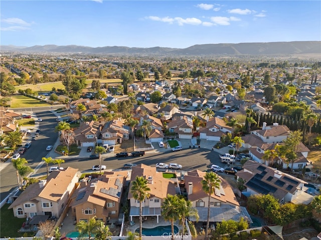 birds eye view of property with a mountain view