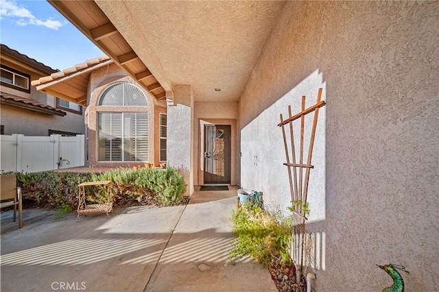 entrance to property with a patio