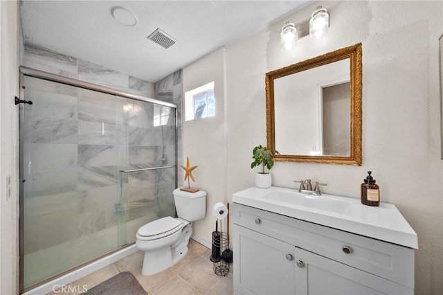 bathroom with toilet, tile patterned flooring, walk in shower, and vanity