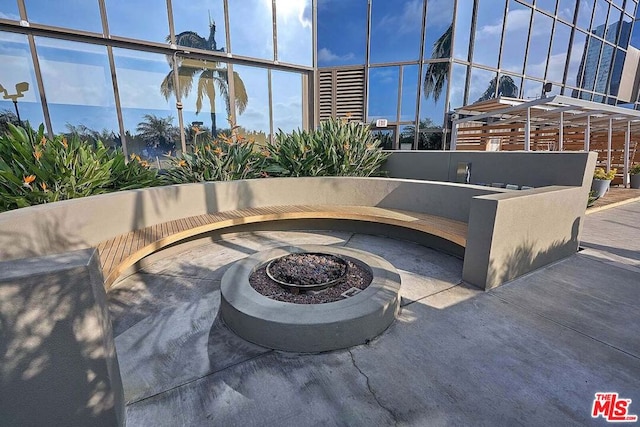 view of patio / terrace featuring a fire pit