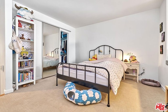 bedroom featuring carpet and a closet