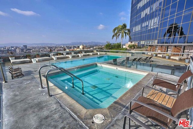 view of pool featuring a community hot tub