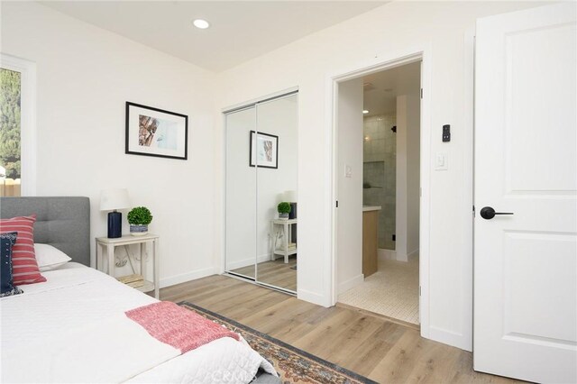 bedroom with light wood-type flooring