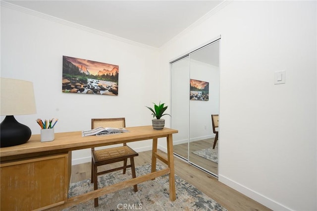 office space featuring hardwood / wood-style flooring and ornamental molding