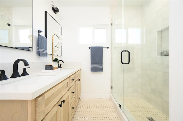 bathroom featuring walk in shower and vanity