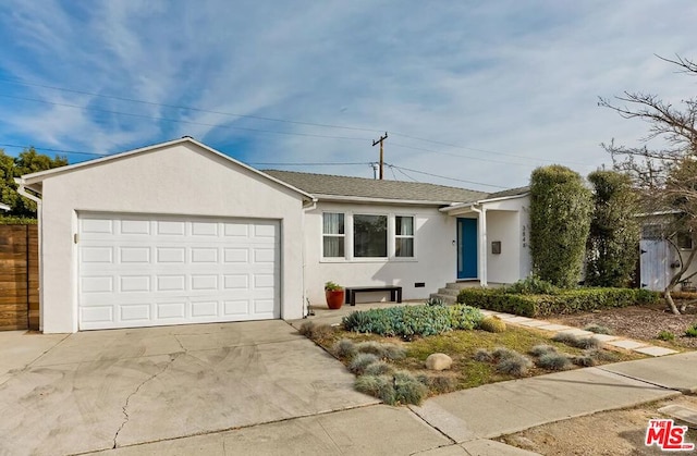 ranch-style home featuring a garage