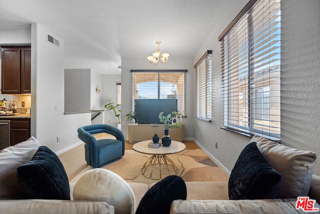 living room with a notable chandelier