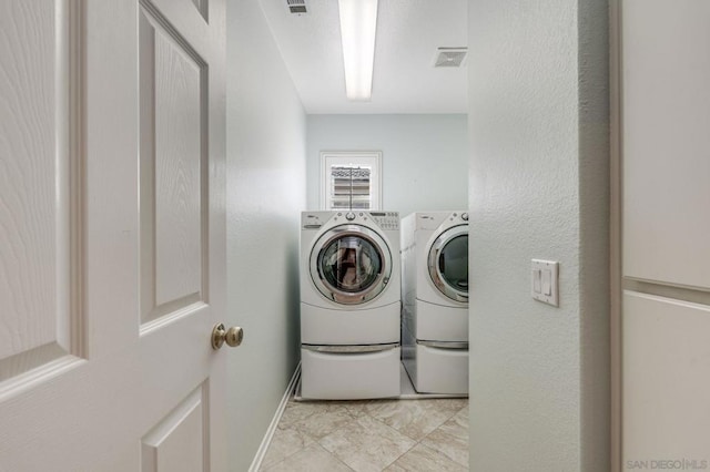 laundry area featuring washing machine and dryer